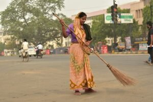 woman holding broom stick during daytime